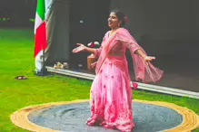 PERFORMING IN THE RAIN IN A BEAUTIFUL PINK DRESS [RAINDROPS ARE VISIBLE IN SOME PHOTOGRAPHS]-235637-1