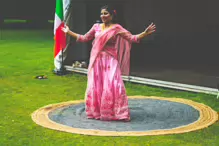 PERFORMING IN THE RAIN IN A BEAUTIFUL PINK DRESS [RAINDROPS ARE VISIBLE IN SOME PHOTOGRAPHS]-235639-1