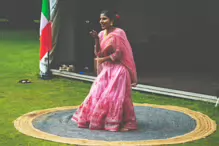 PERFORMING IN THE RAIN IN A BEAUTIFUL PINK DRESS [RAINDROPS ARE VISIBLE IN SOME PHOTOGRAPHS]-235640-1