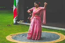 PERFORMING IN THE RAIN IN A BEAUTIFUL PINK DRESS [RAINDROPS ARE VISIBLE IN SOME PHOTOGRAPHS]-235644-1