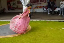 PERFORMING IN THE RAIN IN A BEAUTIFUL PINK DRESS [RAINDROPS ARE VISIBLE IN SOME PHOTOGRAPHS]-235647-1