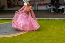 PERFORMING IN THE RAIN IN A BEAUTIFUL PINK DRESS [RAINDROPS ARE VISIBLE IN SOME PHOTOGRAPHS]-235648-1