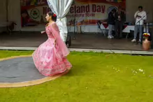 PERFORMING IN THE RAIN IN A BEAUTIFUL PINK DRESS [RAINDROPS ARE VISIBLE IN SOME PHOTOGRAPHS]-235649-1