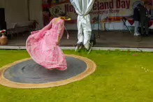 PERFORMING IN THE RAIN IN A BEAUTIFUL PINK DRESS [RAINDROPS ARE VISIBLE IN SOME PHOTOGRAPHS]-235651-1