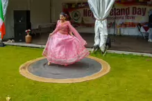 PERFORMING IN THE RAIN IN A BEAUTIFUL PINK DRESS [RAINDROPS ARE VISIBLE IN SOME PHOTOGRAPHS]-235653-1