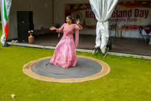 PERFORMING IN THE RAIN IN A BEAUTIFUL PINK DRESS [RAINDROPS ARE VISIBLE IN SOME PHOTOGRAPHS]-235656-1