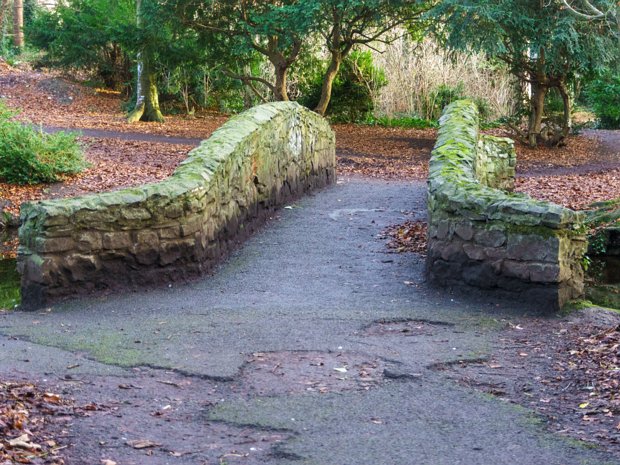 THE STONE BRIDGES 2013 These bridges serve both functional and aesthetic purposes, allowing pedestrians to cross over the park's waterways...