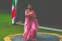 PERFORMING IN THE RAIN IN A BEAUTIFUL PINK DRESS [RAINDROPS ARE VISIBLE IN SOME PHOTOGRAPHS]-235638-1