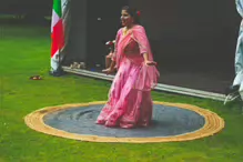 PERFORMING IN THE RAIN IN A BEAUTIFUL PINK DRESS [RAINDROPS ARE VISIBLE IN SOME PHOTOGRAPHS]-235641-1