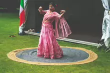 PERFORMING IN THE RAIN IN A BEAUTIFUL PINK DRESS [RAINDROPS ARE VISIBLE IN SOME PHOTOGRAPHS]-235642-1