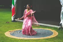 PERFORMING IN THE RAIN IN A BEAUTIFUL PINK DRESS [RAINDROPS ARE VISIBLE IN SOME PHOTOGRAPHS]-235643-1