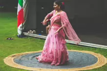 PERFORMING IN THE RAIN IN A BEAUTIFUL PINK DRESS [RAINDROPS ARE VISIBLE IN SOME PHOTOGRAPHS]-235645-1