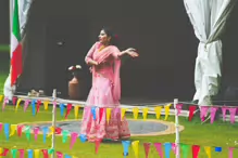 PERFORMING IN THE RAIN IN A BEAUTIFUL PINK DRESS [RAINDROPS ARE VISIBLE IN SOME PHOTOGRAPHS]-235646-1