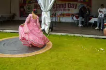 PERFORMING IN THE RAIN IN A BEAUTIFUL PINK DRESS [RAINDROPS ARE VISIBLE IN SOME PHOTOGRAPHS]-235650-1