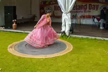 PERFORMING IN THE RAIN IN A BEAUTIFUL PINK DRESS [RAINDROPS ARE VISIBLE IN SOME PHOTOGRAPHS]-235652-1