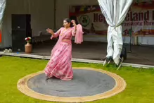 PERFORMING IN THE RAIN IN A BEAUTIFUL PINK DRESS [RAINDROPS ARE VISIBLE IN SOME PHOTOGRAPHS]-235654-1