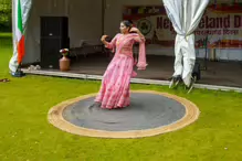 PERFORMING IN THE RAIN IN A BEAUTIFUL PINK DRESS [RAINDROPS ARE VISIBLE IN SOME PHOTOGRAPHS]-235655-1