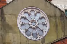 A ROUND WINDOW REPRESENTING THE WHEEL OF AN OLD SHIP [THE BUILDING WAS DEMOLISHED A FEW YEARS LATER]-234390-1