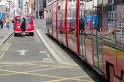 A VERY DISTINCTIVE RED TRAM PROMOTING KFC [AN EXAMPLE OF FULL BODY ADVERTISING REFERRED TO AS WRAPPING]-236695-1