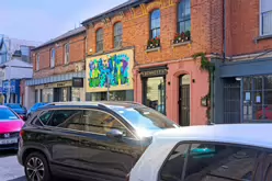 THE BUNKER IN BLACKROCK WITH A SIGN BY STREET ARTIST DECOY [IT WOULD APPEAR THAT THEY HAVE CEASED TRADING]-238368-1