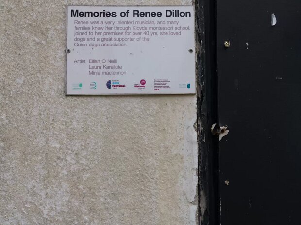 RENEE DILLON PLAQUE While specific details about the plaque and its creators, artists Eilish O’Neill, Laura Karaliute, and Minja Maclennon,...