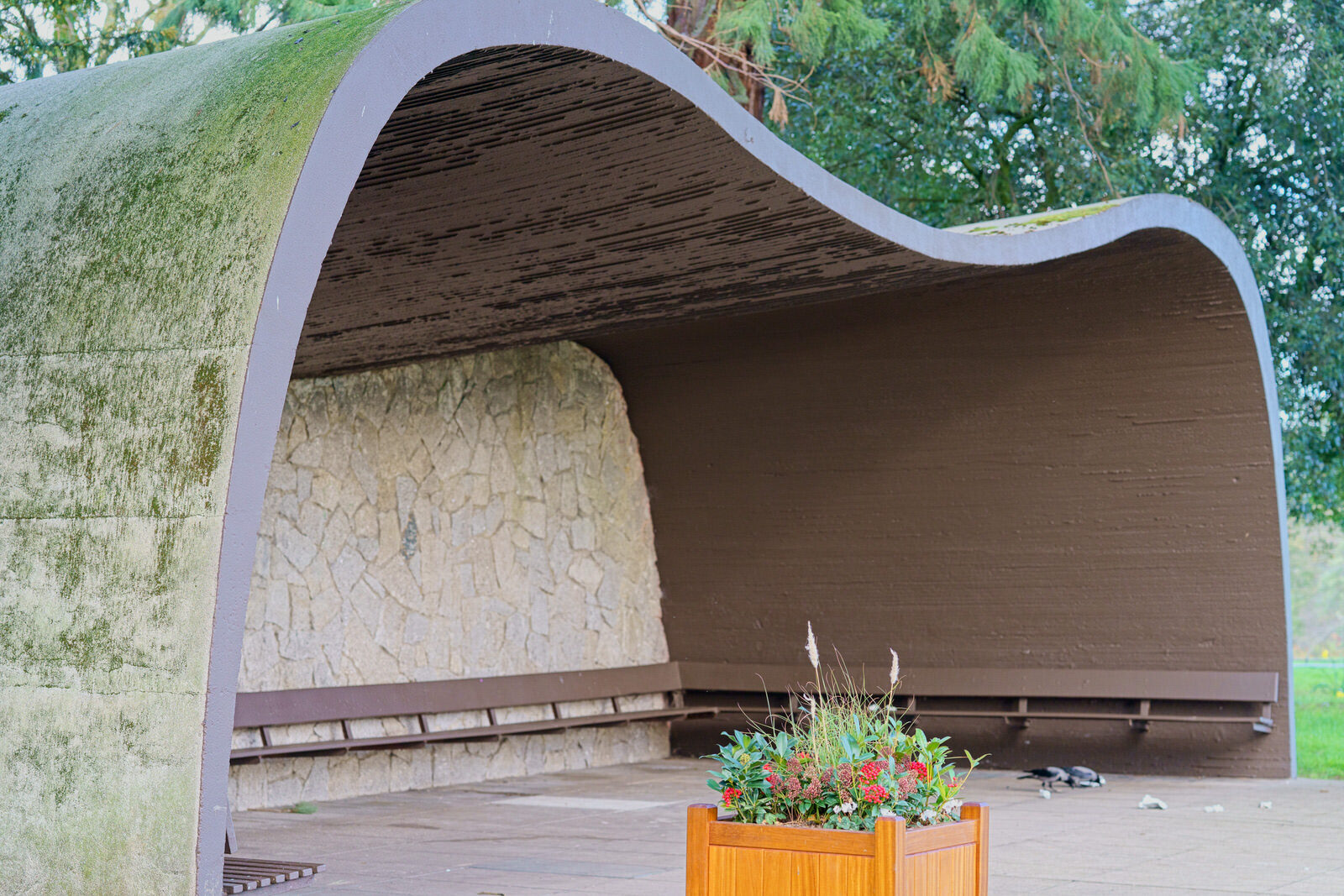 THE CONCRETE SHELTER AND THE CORTEN STEEL SCULPTURE [EMBRACED LOOP BY ANAISA FRANCO]-228475-1