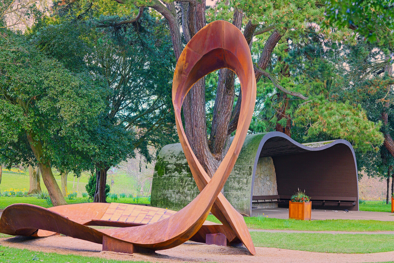 THE CONCRETE SHELTER AND THE CORTEN STEEL SCULPTURE [EMBRACED LOOP BY ANAISA FRANCO]-228483-1