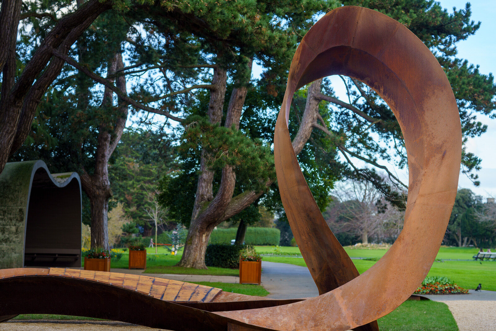 THE CONCRETE SHELTER AND THE CORTEN STEEL SCULPTURE [EMBRACED LOOP BY ANAISA FRANCO]-228486-1