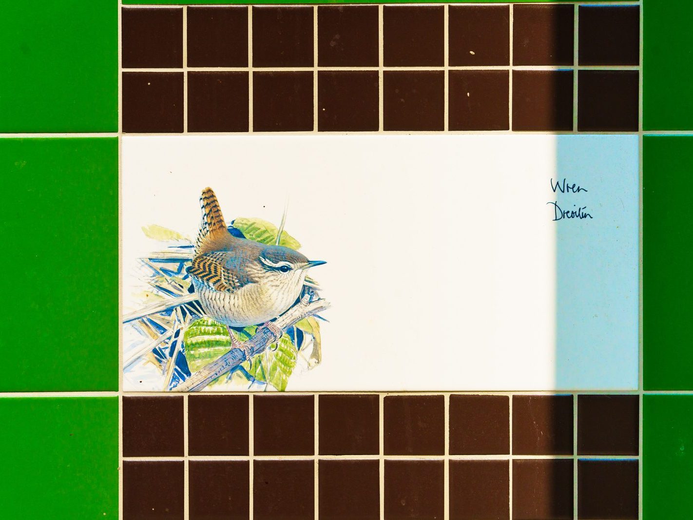 A SET OF THREE TILES FEATURING THE WREN AND THE GOLDCREST [BY KILLIAN MULLARNEY]-239287-1