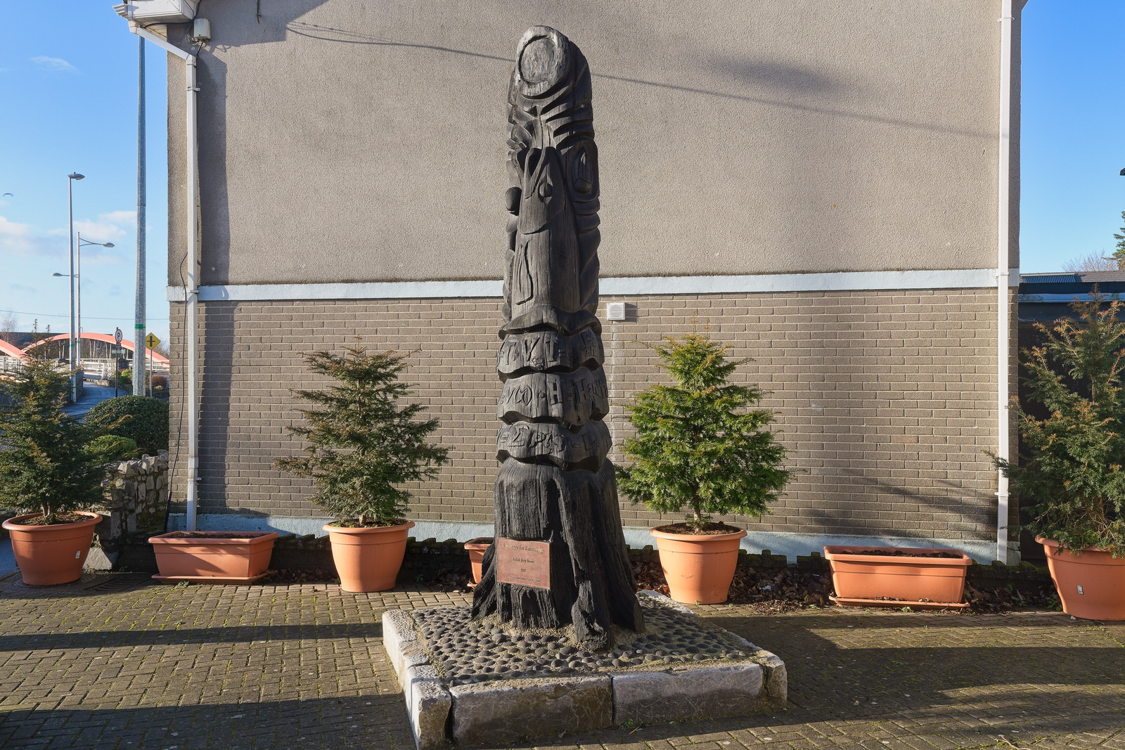 A HUNGER FOR KNOWLEDGE BY JOEY BURNS PLUS A MURAL[A BOG OAK SCULPTURE REPRESENTING THE SALMON OF KNOWLEDGE]
 002