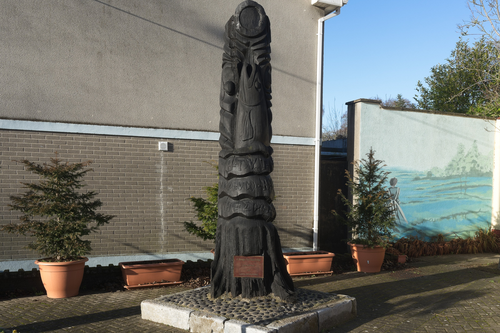 A HUNGER FOR KNOWLEDGE BY JOEY BURNS PLUS A MURAL[A BOG OAK SCULPTURE REPRESENTING THE SALMON OF KNOWLEDGE]
 003