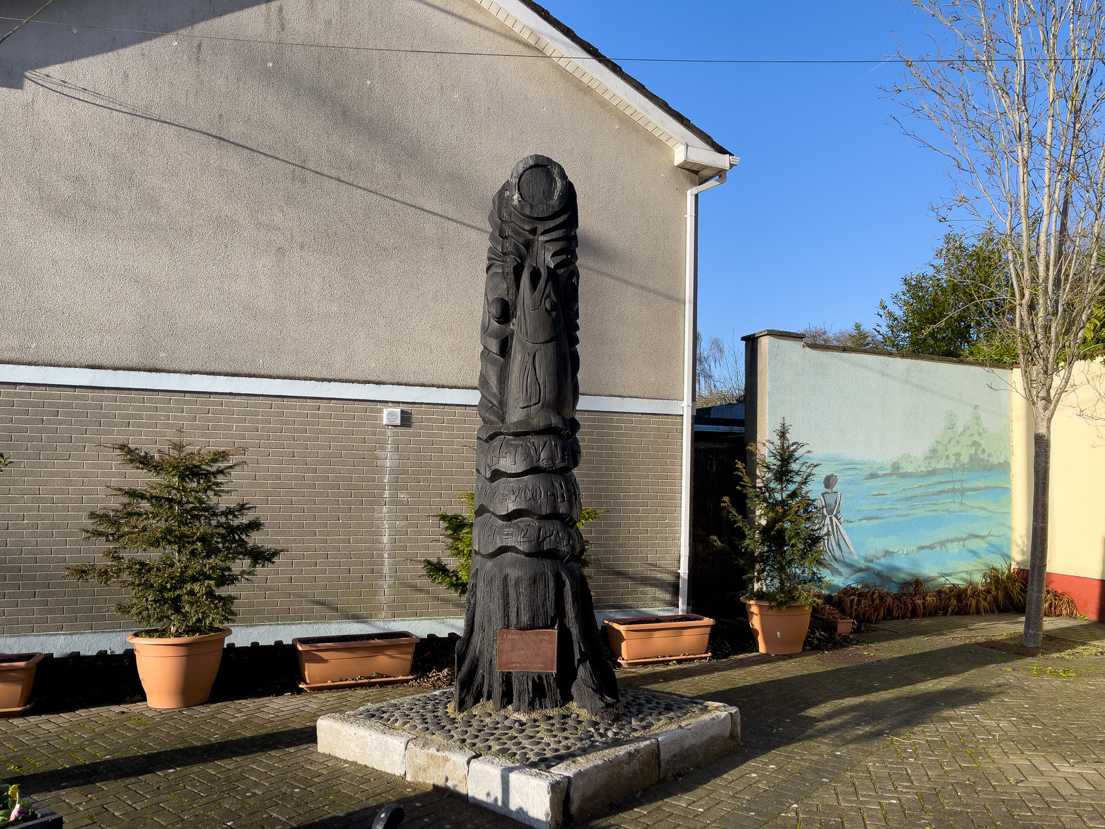A HUNGER FOR KNOWLEDGE BY JOEY BURNS PLUS A MURAL[A BOG OAK SCULPTURE REPRESENTING THE SALMON OF KNOWLEDGE]
 005