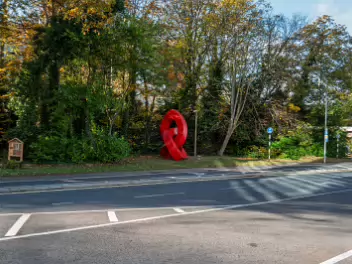 TRIPLE INFINITY BY JOAN WALSH-SMITH The artist listed on the plaque, Joan Smith, is Joan Walsh-Smith OAM. She is an Irish-born sculptor who works...