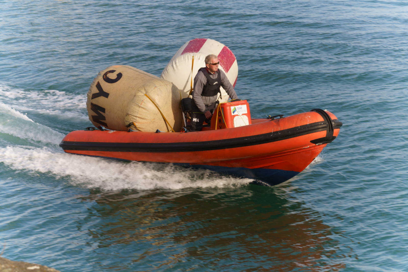 A MAN AND HIS TWO BUOYS IN A RIB [DUN LAOGHAIRE HARBOUR WEST PIER] 002