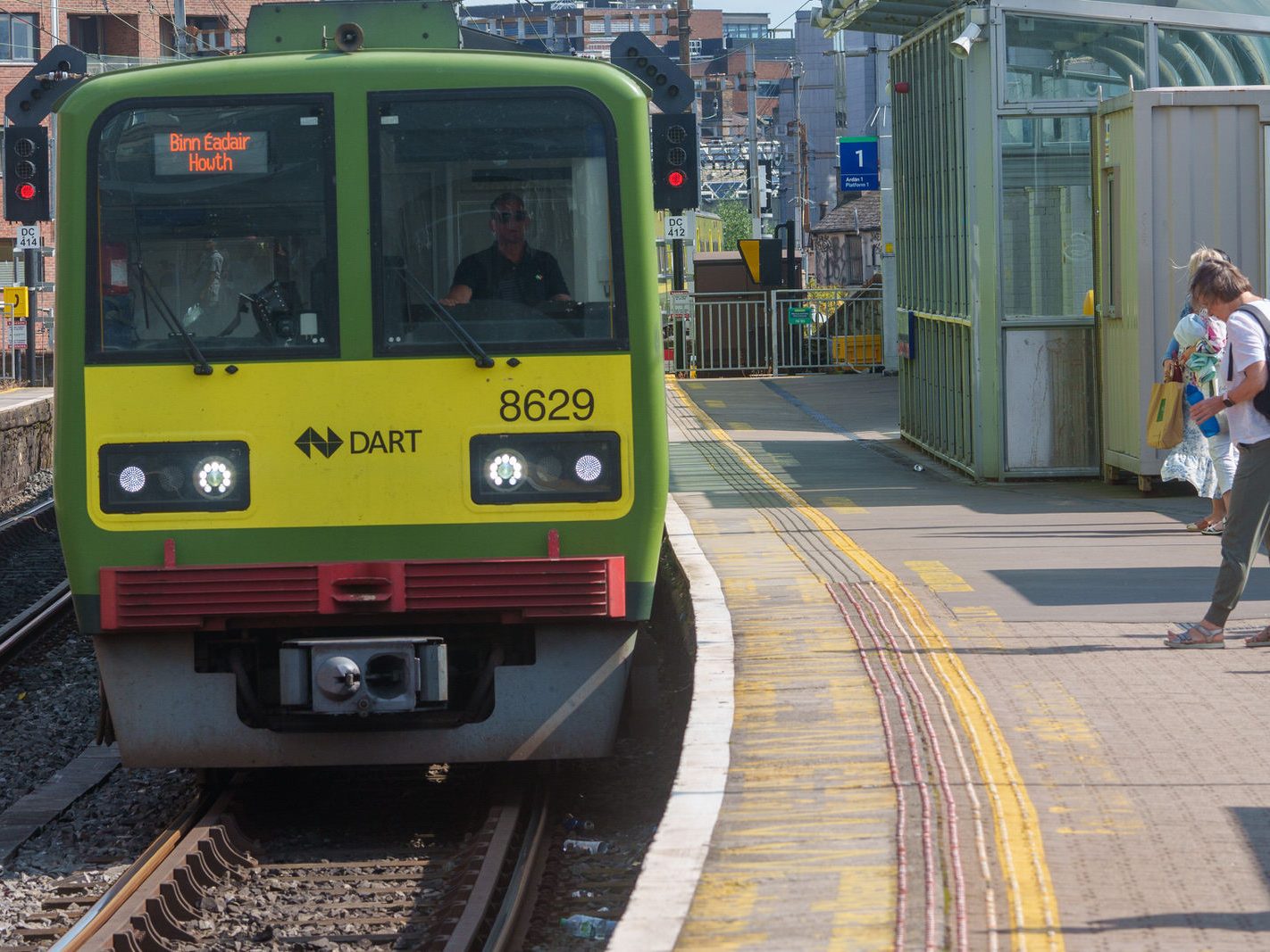 DART TRAINS COMING AND GOING WHILE THE RUGBY FANS ARREAR TO BE CONFUSED [TARA STREET STATION IN DUBLIN] 013
