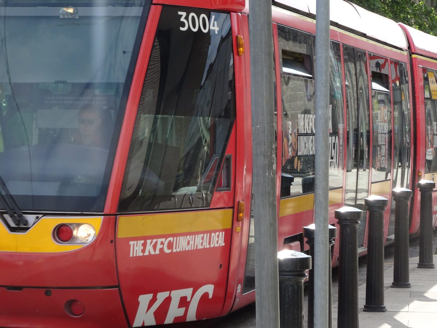 A VERY DISTINCTIVE RED TRAM PROMOTING KFC [AN EXAMPLE OF FULL BODY ADVERTISING REFERRED TO AS WRAPPING]-236691-1