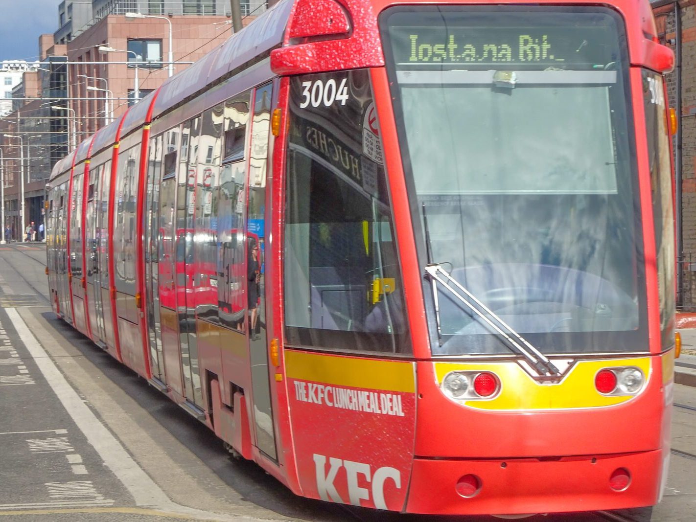 A VERY DISTINCTIVE RED TRAM PROMOTING KFC [AN EXAMPLE OF FULL BODY ADVERTISING REFERRED TO AS WRAPPING]-236696-1