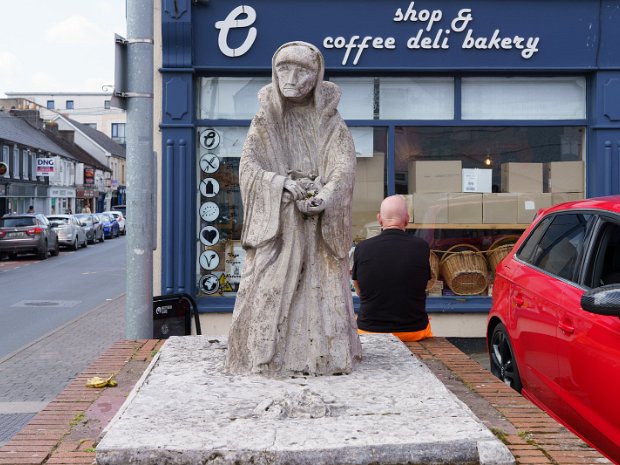 STATUE OF OLD WOMAN