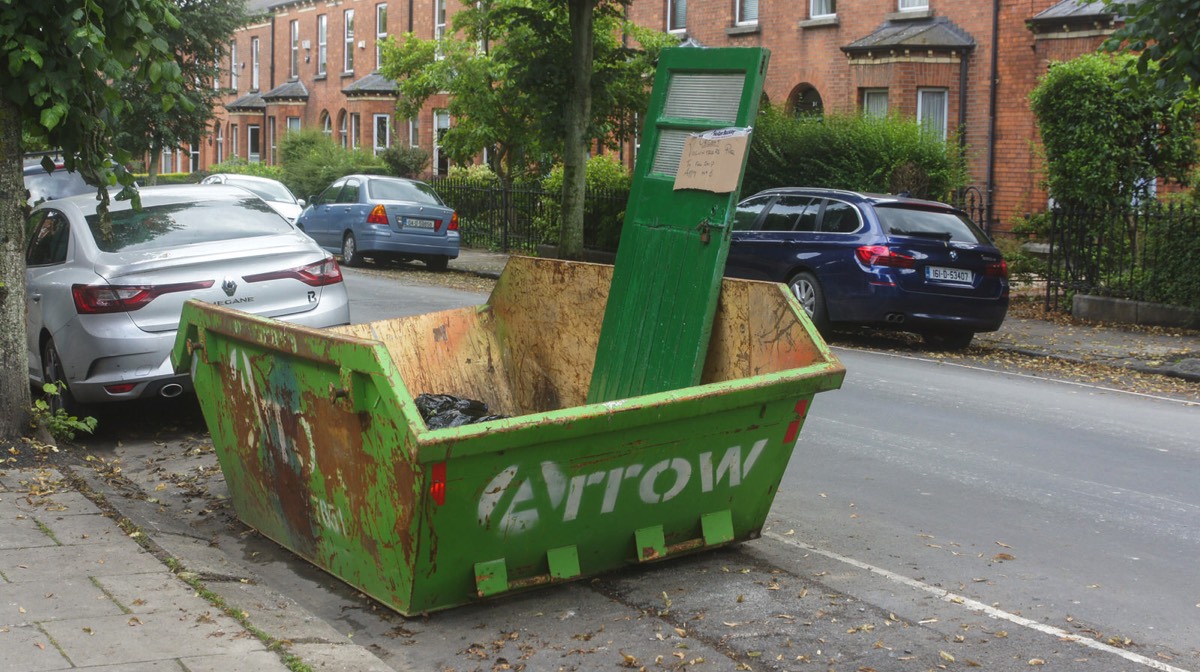 A DOOR IN A SKIP - VOLUNTEERS REQUIRED TO FILL IT 001