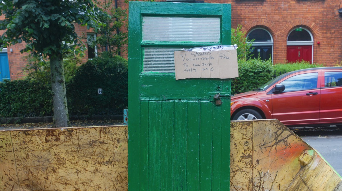 A DOOR IN A SKIP - VOLUNTEERS REQUIRED TO FILL IT 002