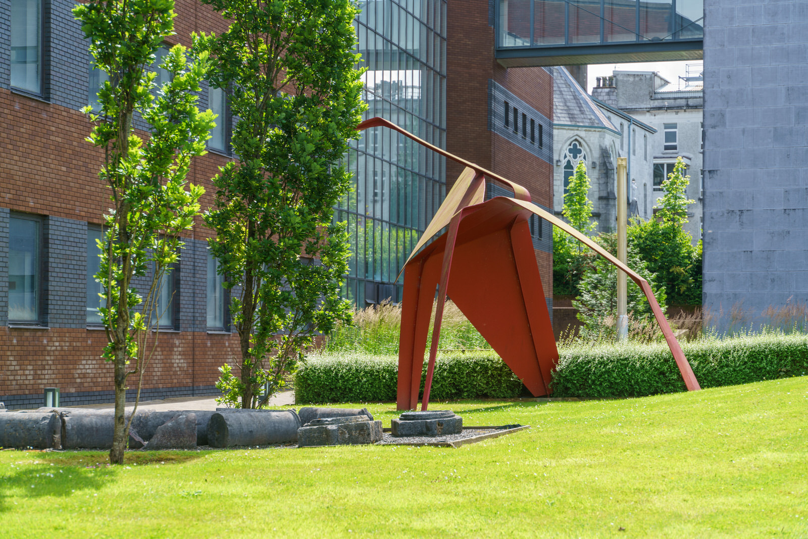  RED METAL SCULPTURE ON UNIVERSITY CAMPUS